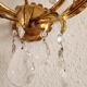 Hand-forged wall lamp gilded with gold leaf and crystals, Italy