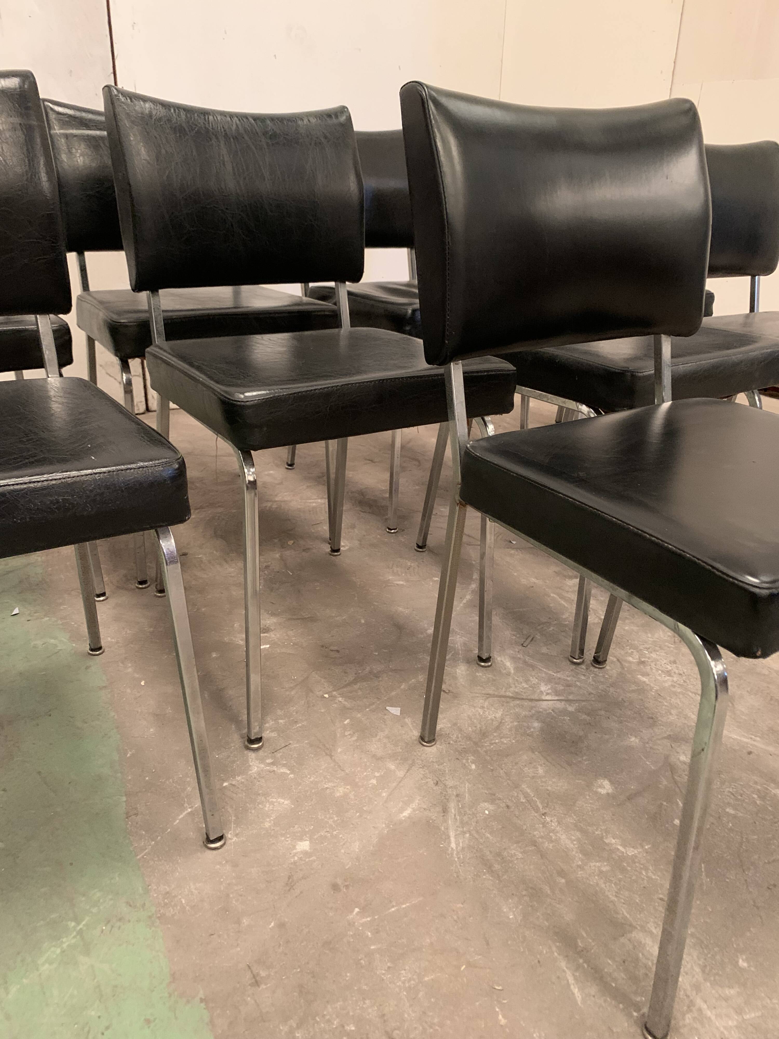 Suite of nine vintage chairs in chrome and imitation leather XX century