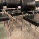 Suite of nine vintage chairs in chrome and imitation leather XX century