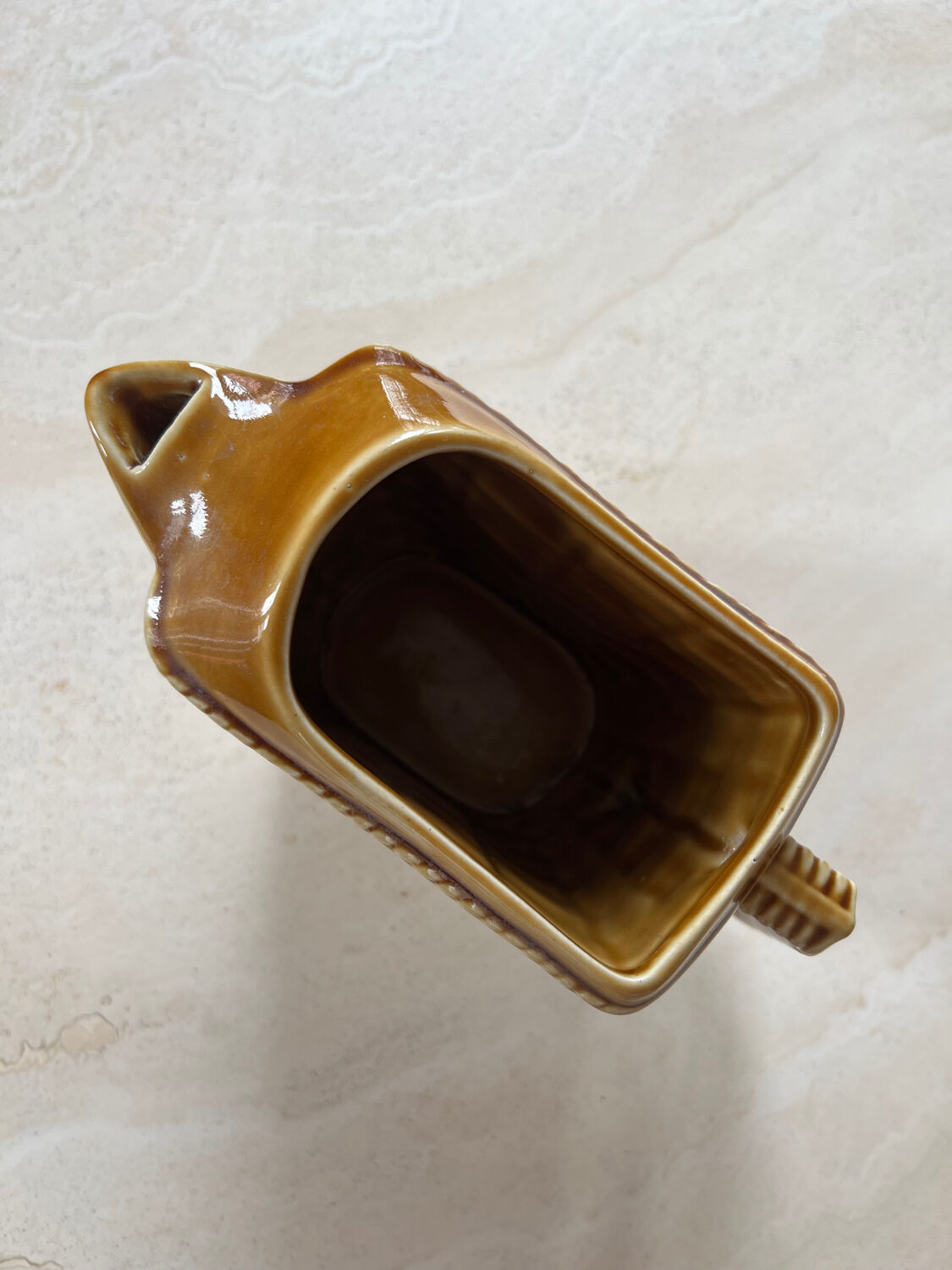 Ceramic pitcher braided pattern