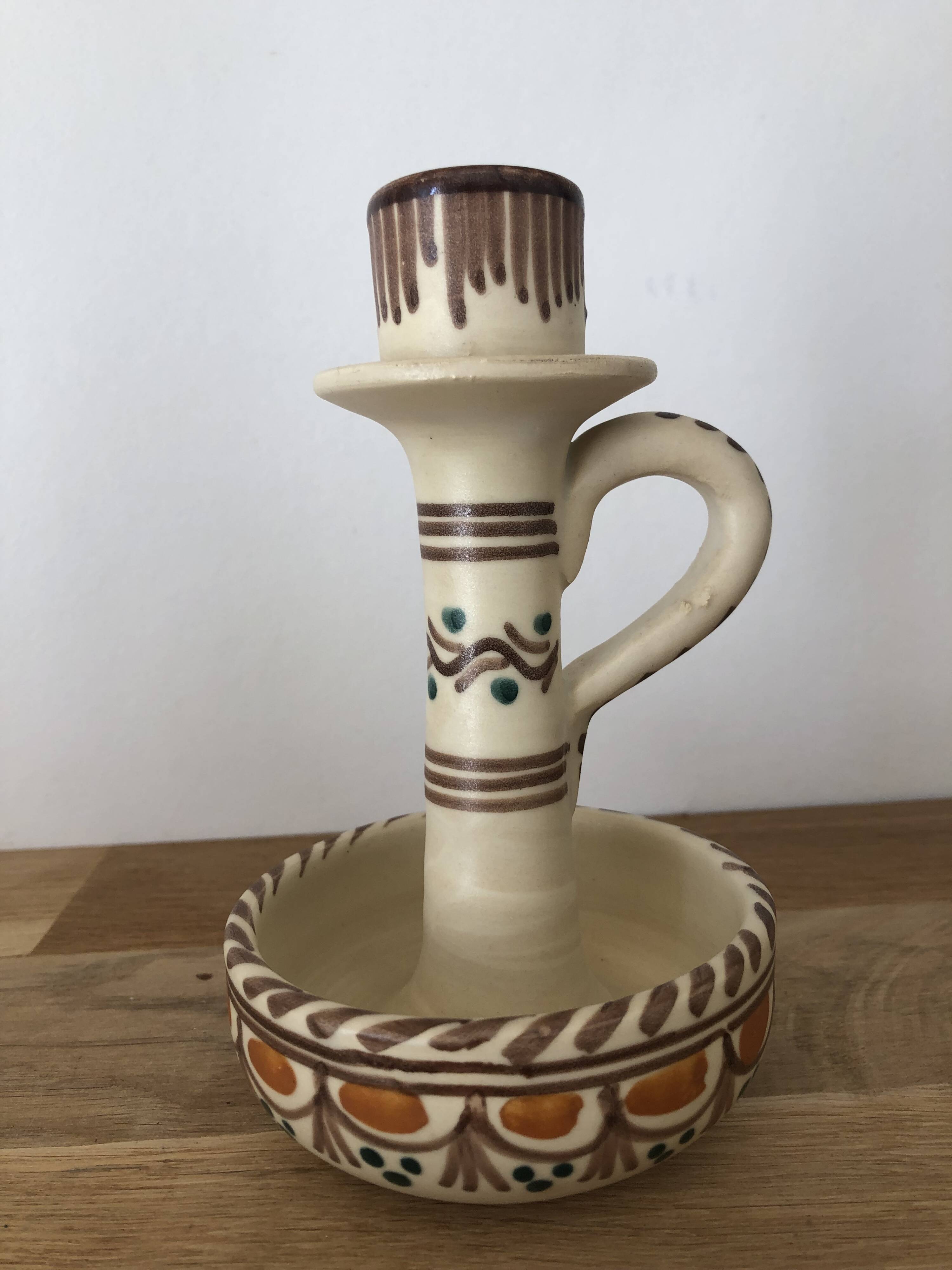 Set of two candlesticks/candle holders in orange and brown tones
