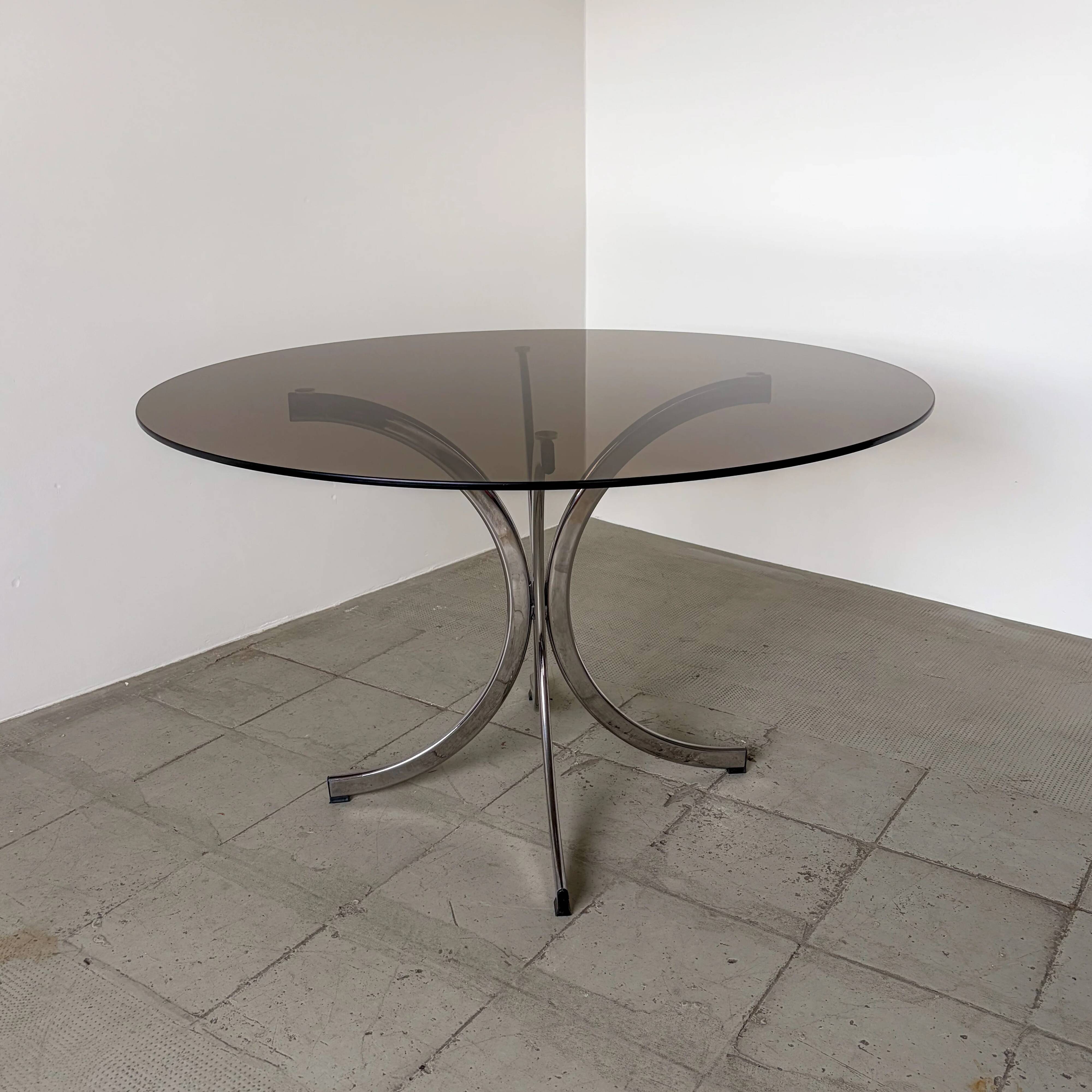 1970s Italian dining table in smoked glass and chrome.