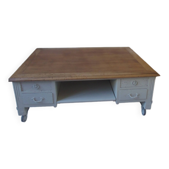 Coffee table on casters, made from an old desk, pearl gray base and belt.