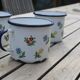 Enamelled sheet metal cups