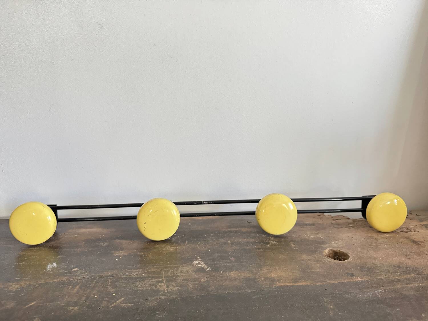Wall coat rack with 4 vintage yellow metal hooks