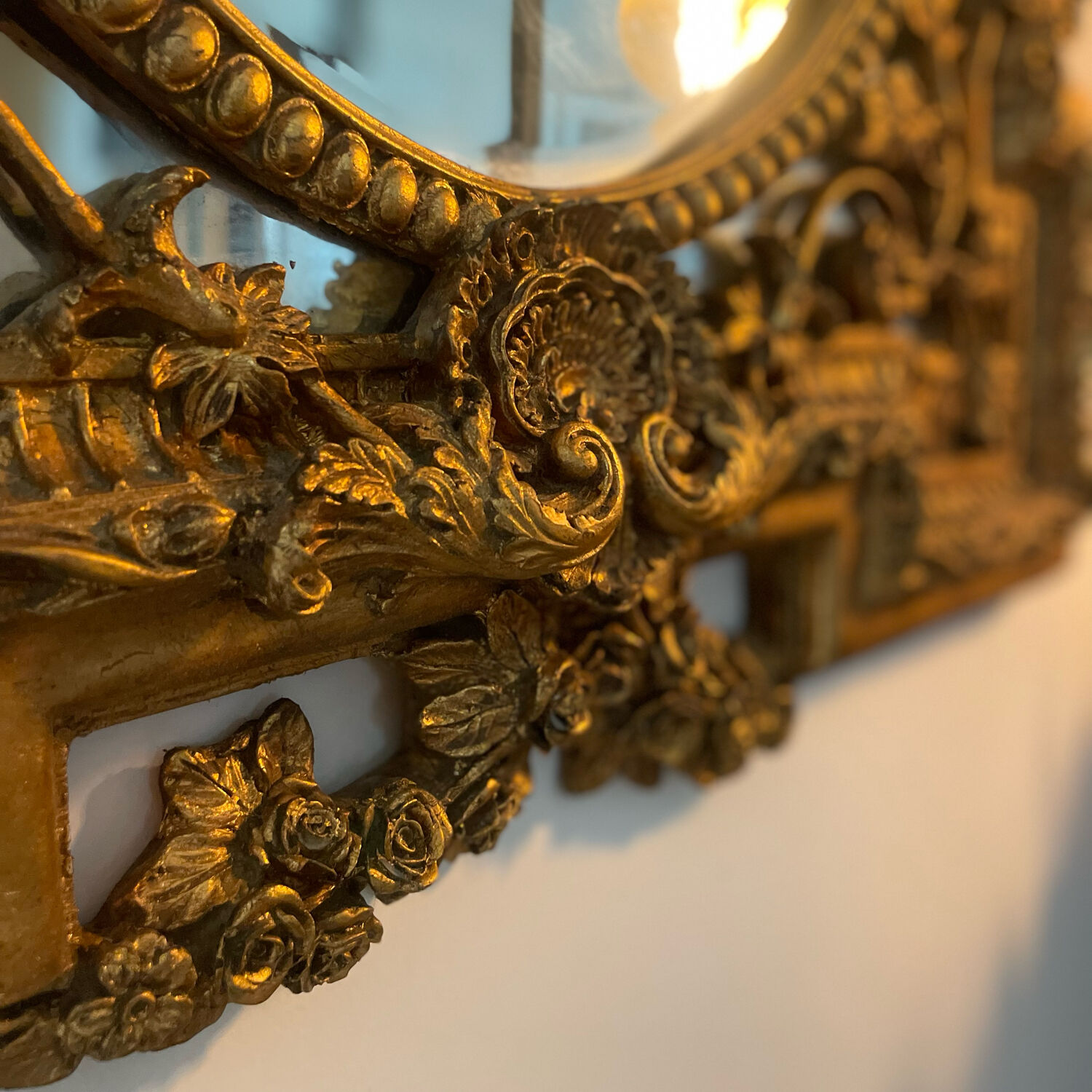 Antique mirror with gold leaf parecloses