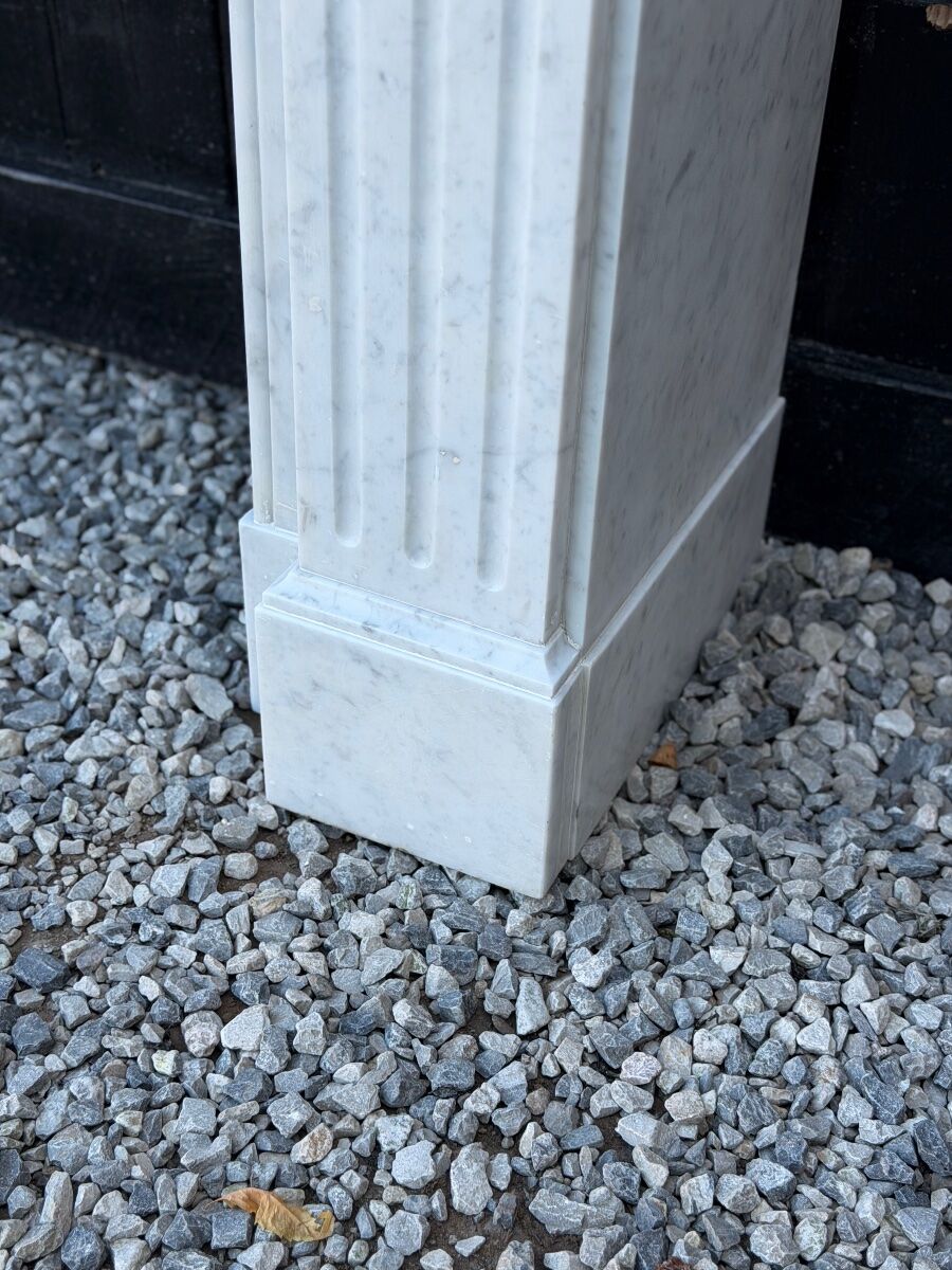 Louis XVI style fireplace in white Carrara marble, circa 1880.