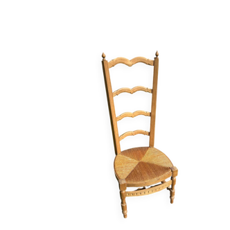 Low chair with a high backrest