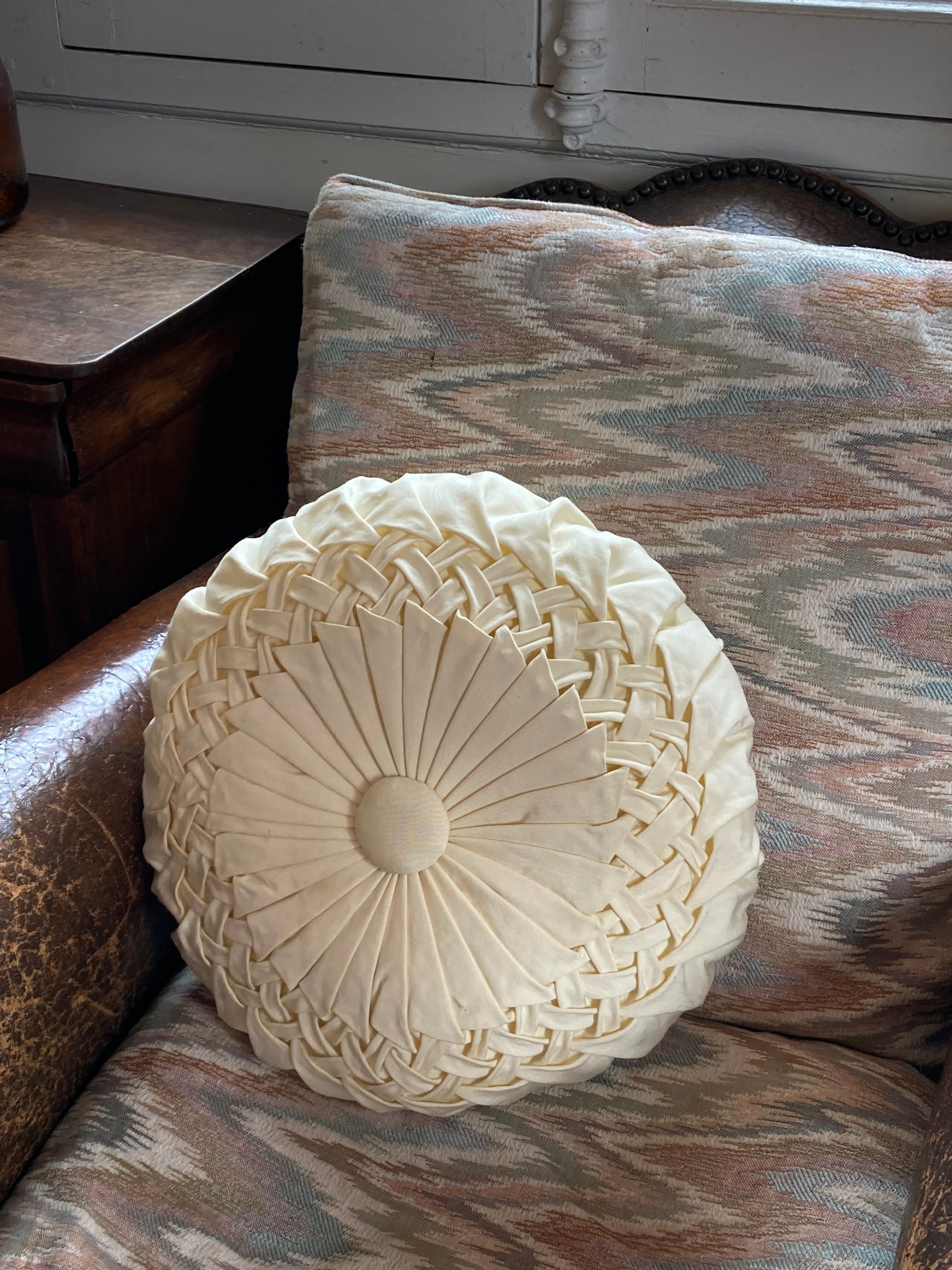 Cushion in beige fabric