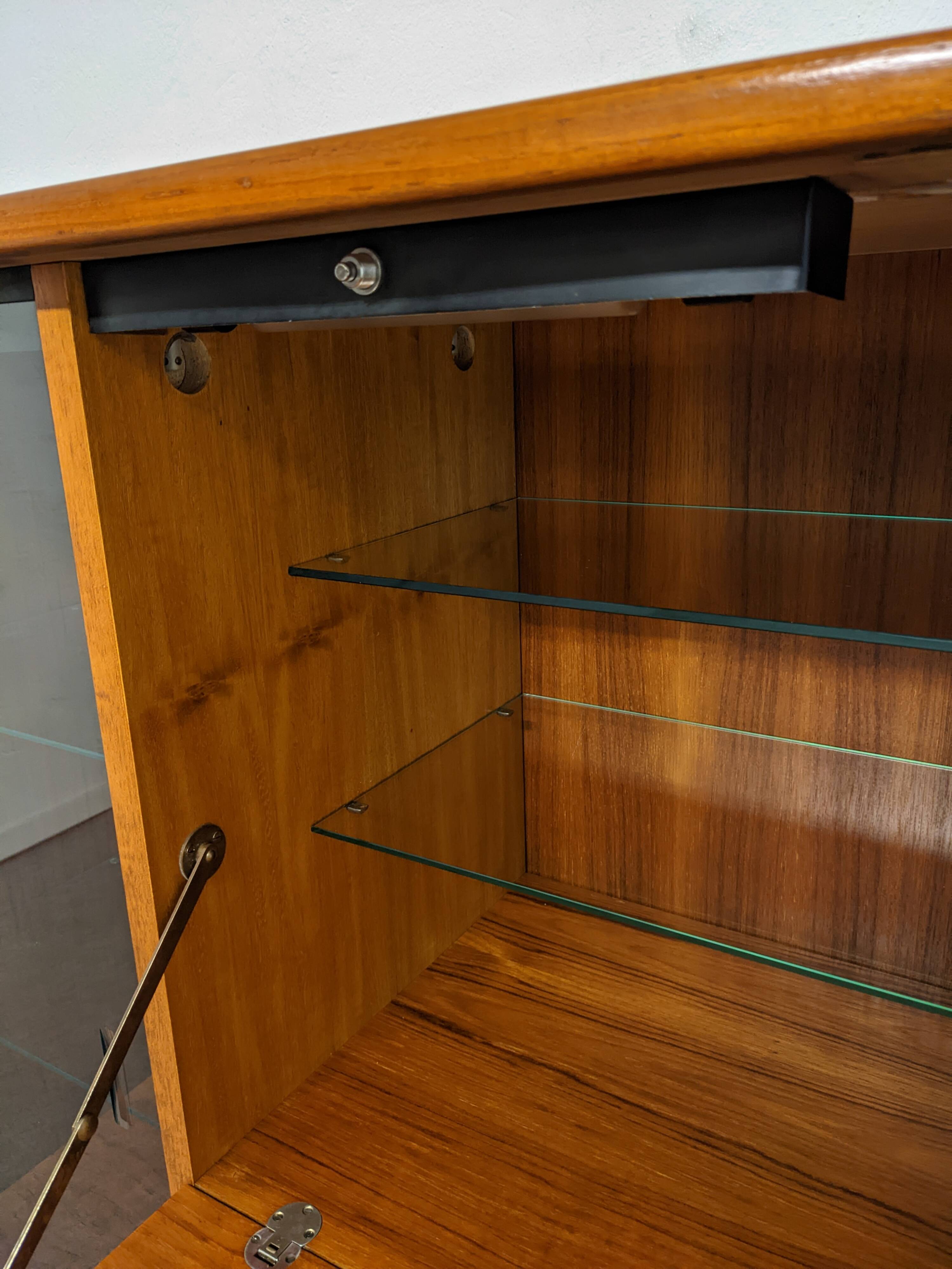 High sideboard, display cabinet and secretary, Scandinavian in teak, France around 1960.