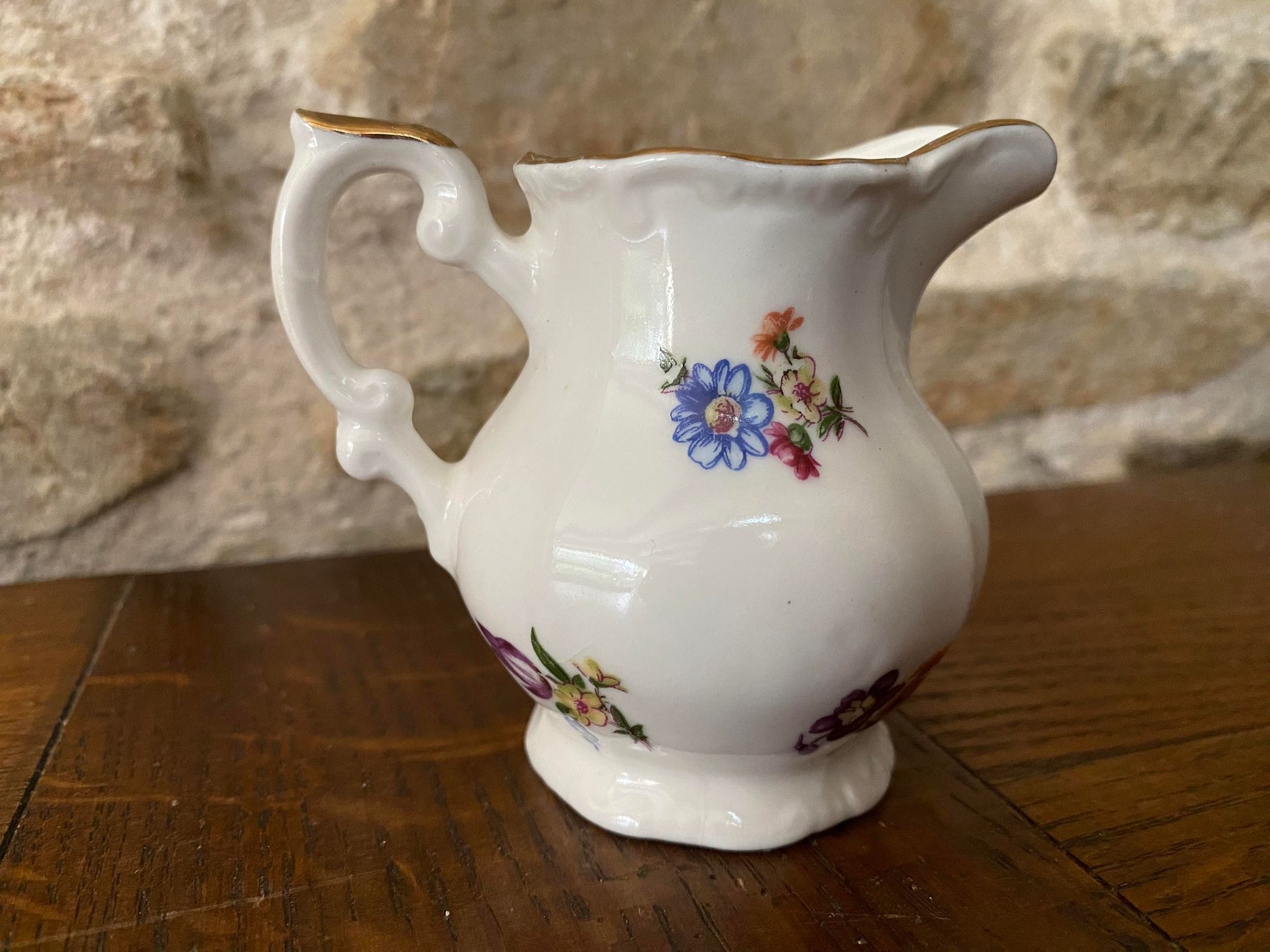 Small milk jug or creamer decoration flowers and golden edge