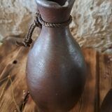 Dark brown stoneware jugs and pitchers with their cord