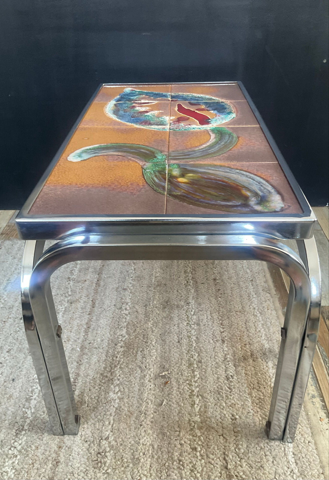 Vintage coffee table in stainless steel and ceramic from the 1970s.