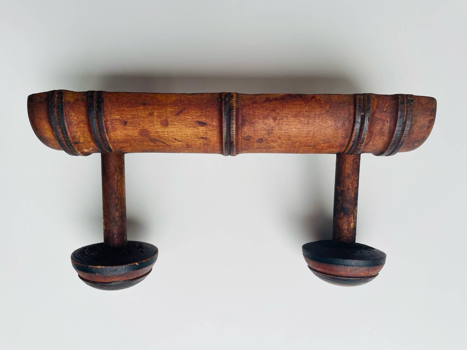 Wooden wall-mounted coat rack with two hooks