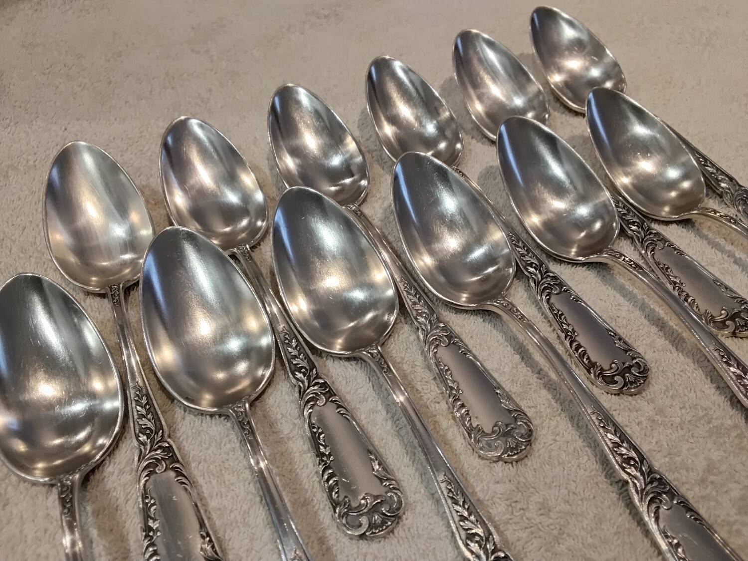 12 silver-plated metal dessert spoons, silversmith SFAM, rocaille design, 19.1 cm.