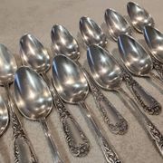12 silver-plated metal dessert spoons, silversmith SFAM, rocaille design, 19.1 cm.