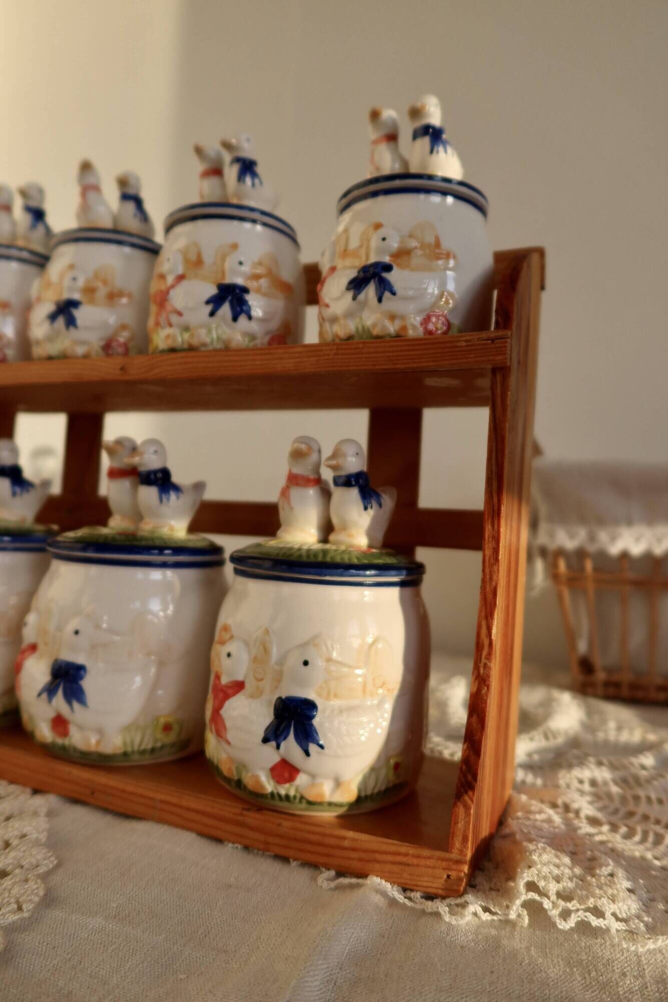 Vintage wooden wall condiment shelf and porcelain pots with geese slip pattern