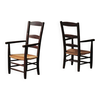 Pair of solid wood and straw armchairs, France, circa 1950.