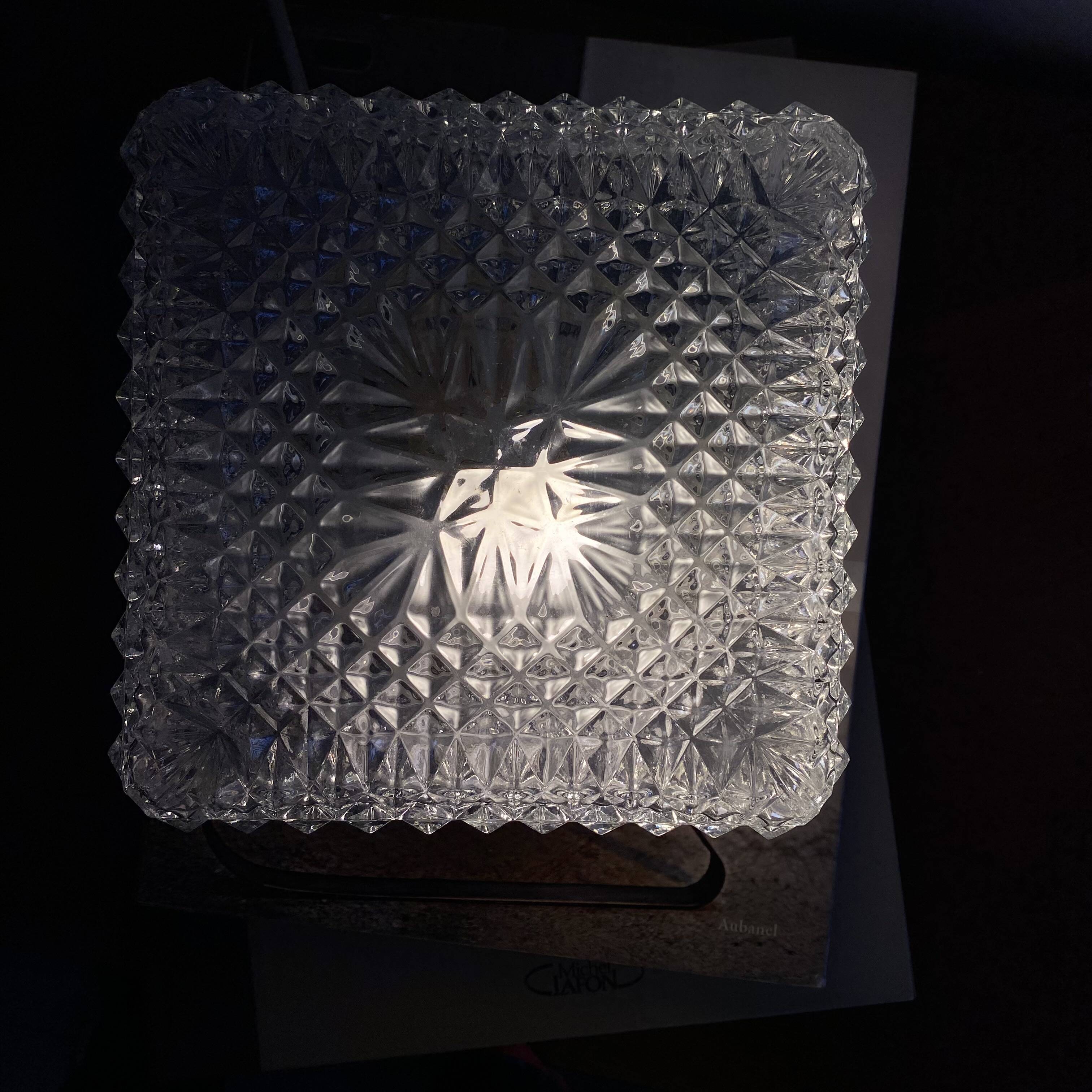 Small square wall-mounted ceiling light with transparent glass, vintage fixture.