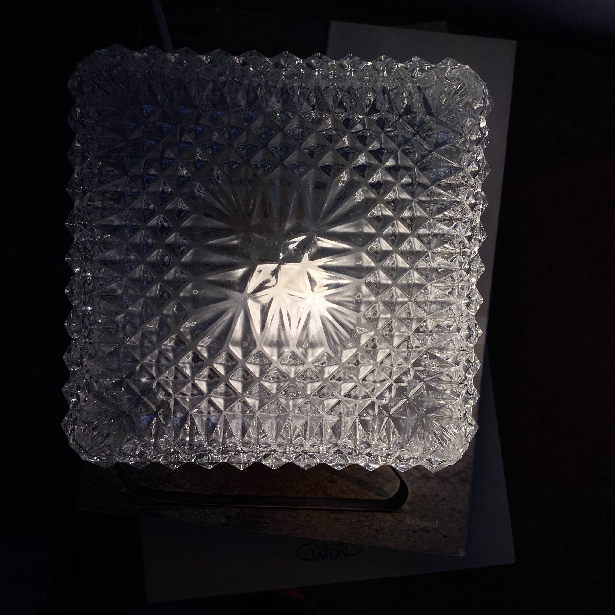 Small square wall-mounted ceiling light with transparent glass, vintage fixture.