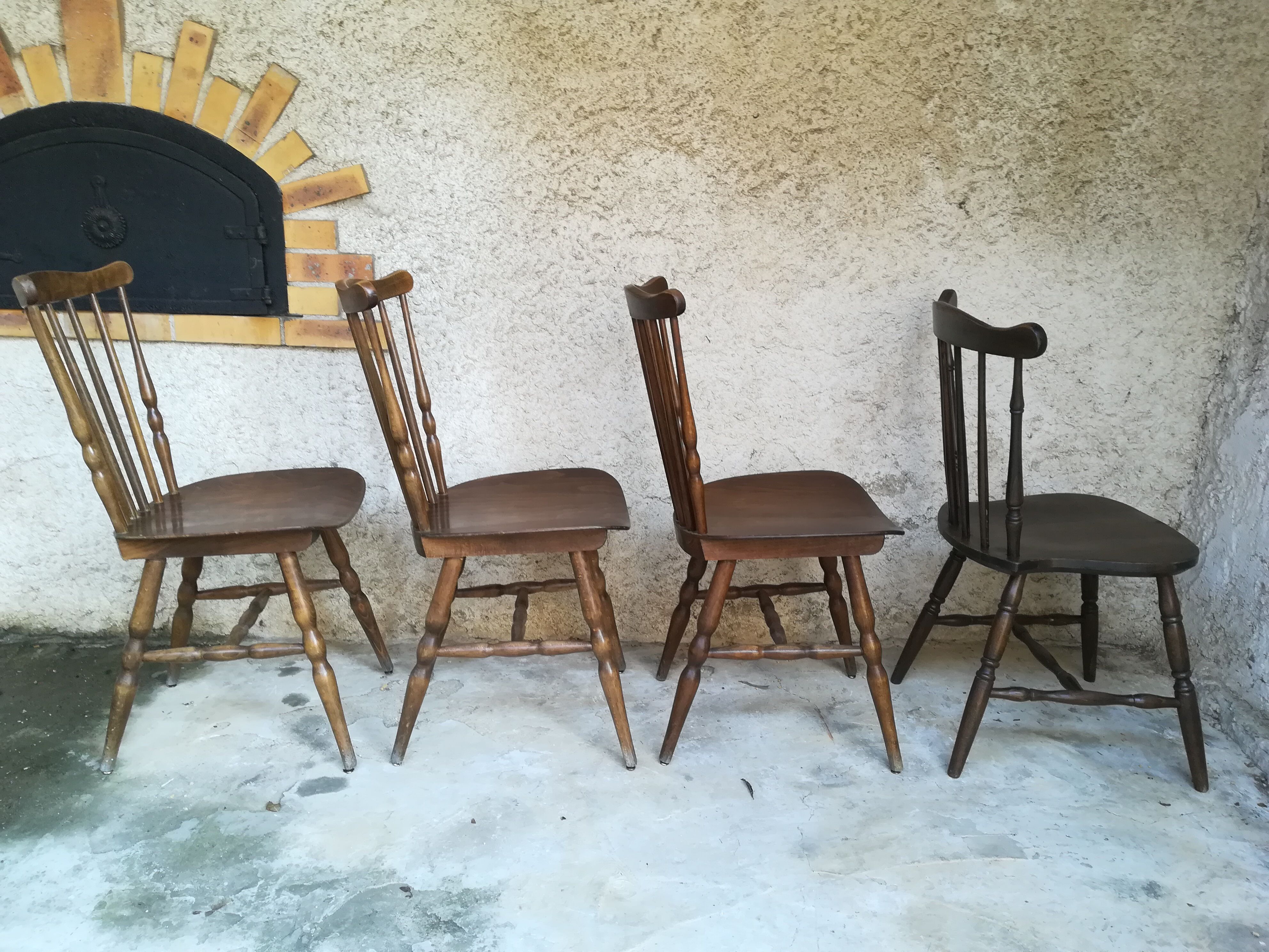 Eight mismatched bistro chairs
