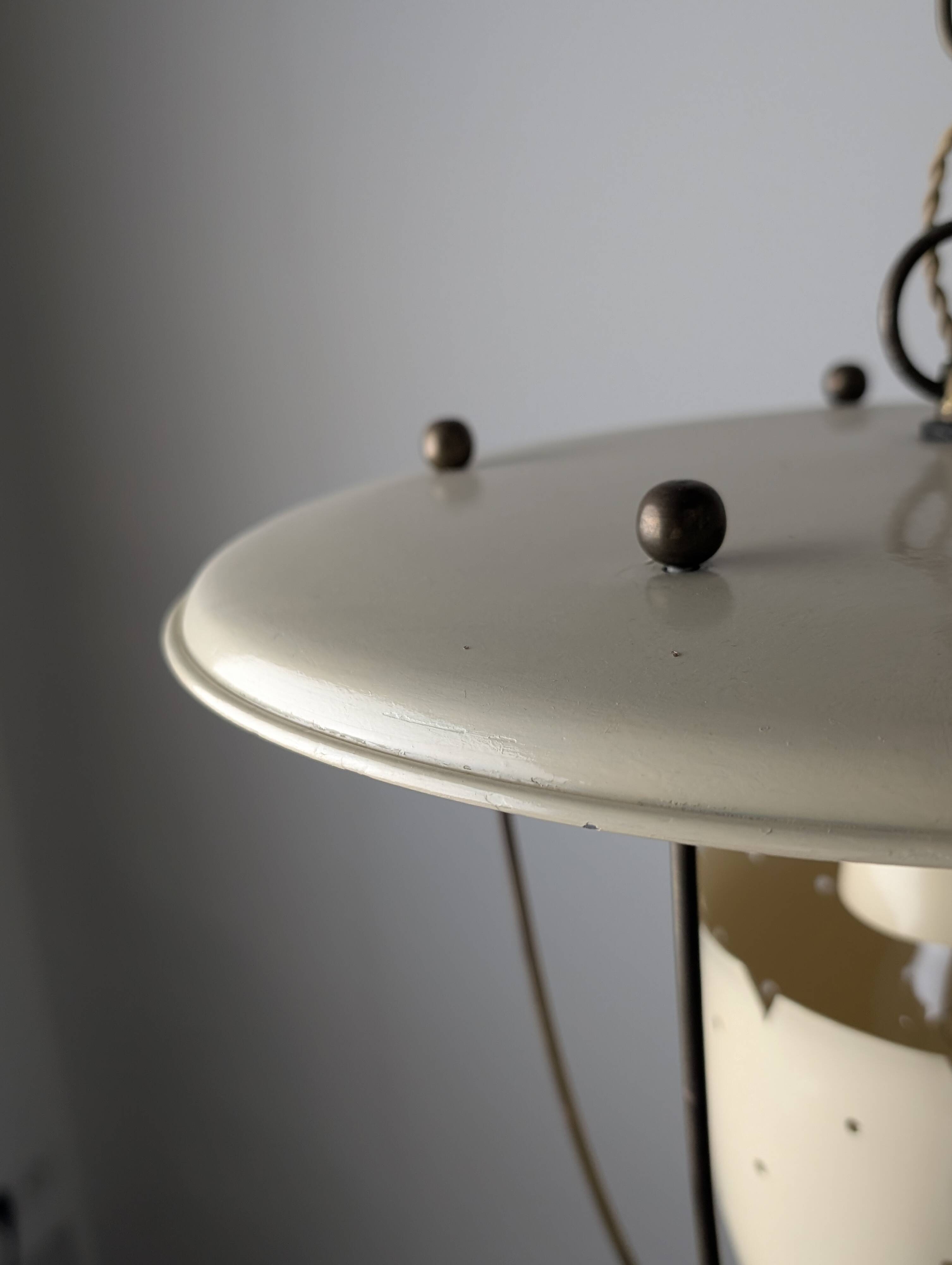 Perforated metal pendant lamp with brass details, Italy, 1940s