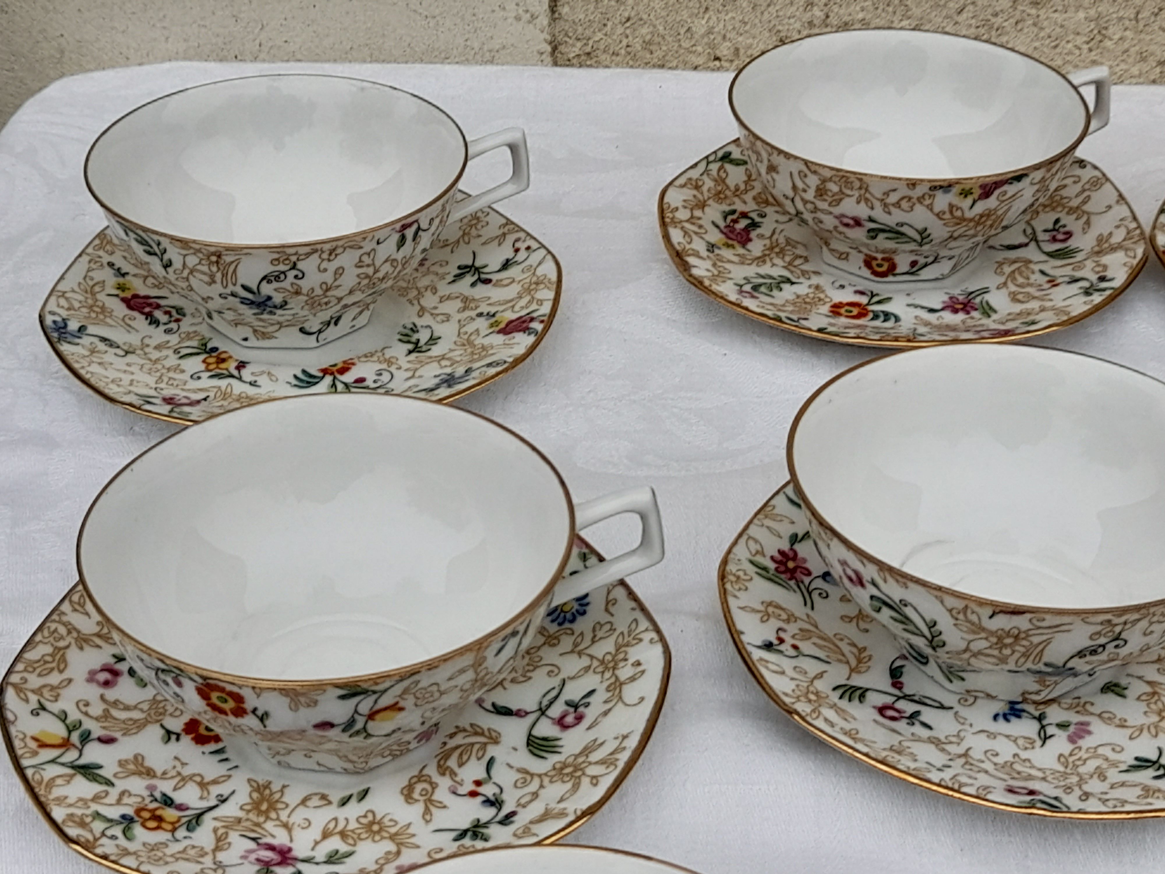 Lourioux Foecy porcelain tea set 12 cups, a sugar bowl and a crèmier