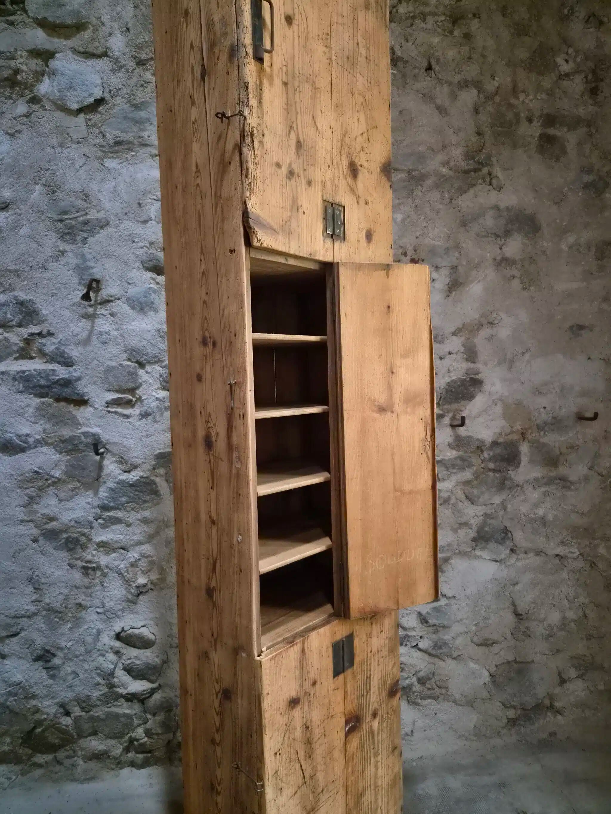 Antique French workshop cabinet in pine with compartments.