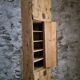 Antique French workshop cabinet in pine with compartments.