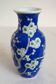 Old blue vase with vintage porcelain cherry blossoms