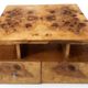 An Art Deco coffee table made of beech wood and elm burl with drawers.