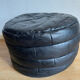 Patchwork black leather pouf de Sède
