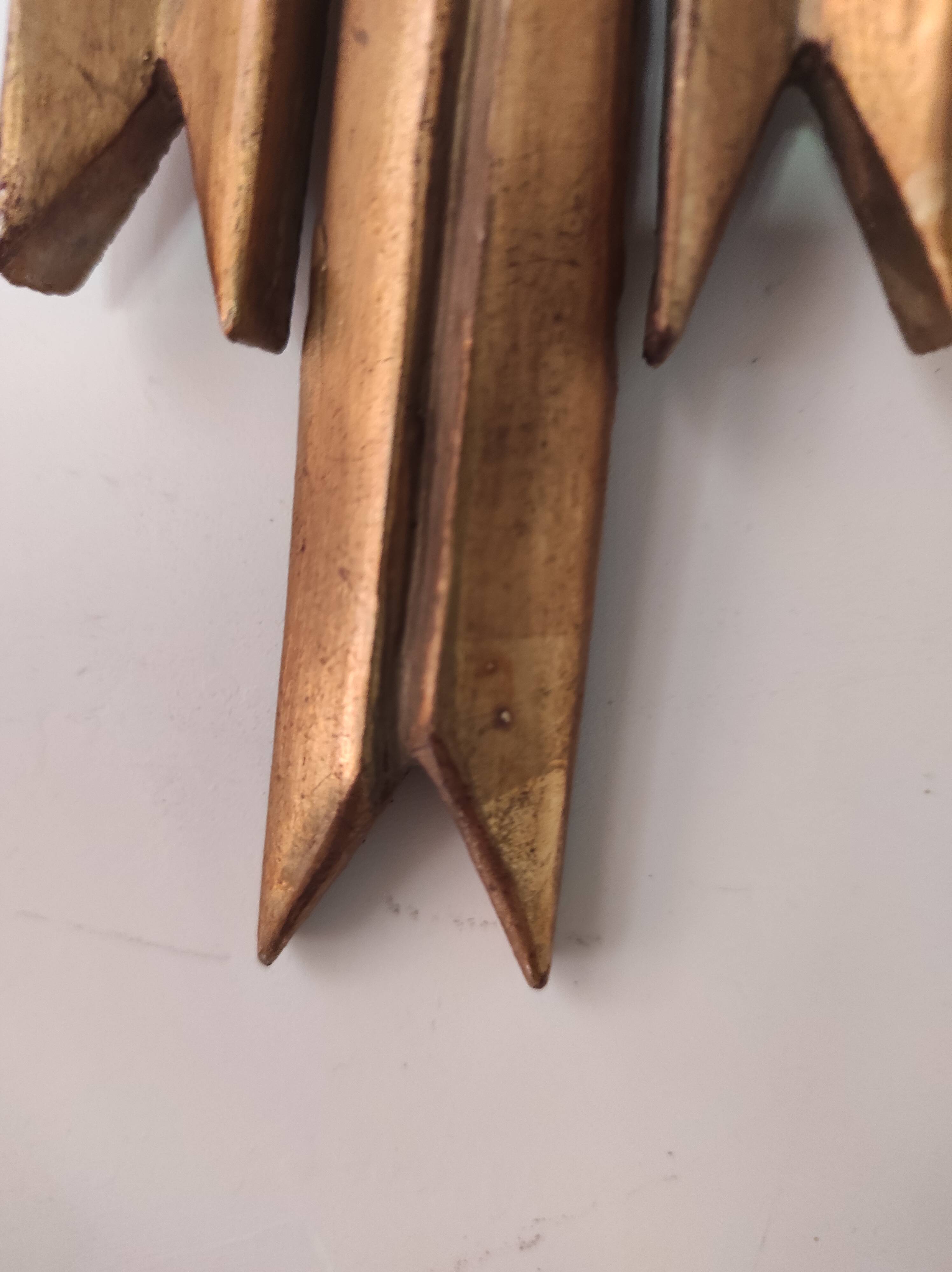 Sun mirror and witch's eye in gilded wood