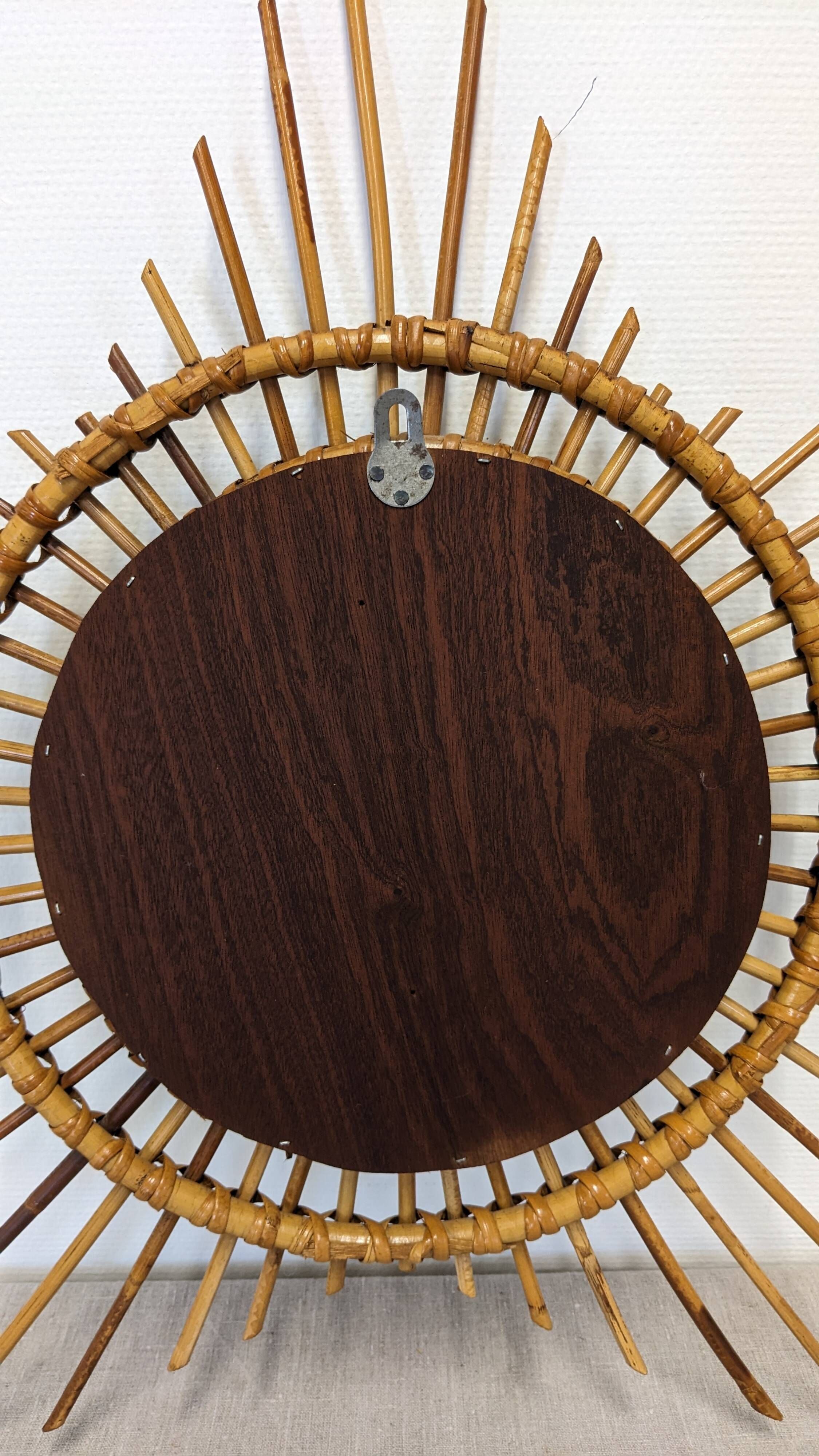 Starry sun mirror in rattan, France around 1960.