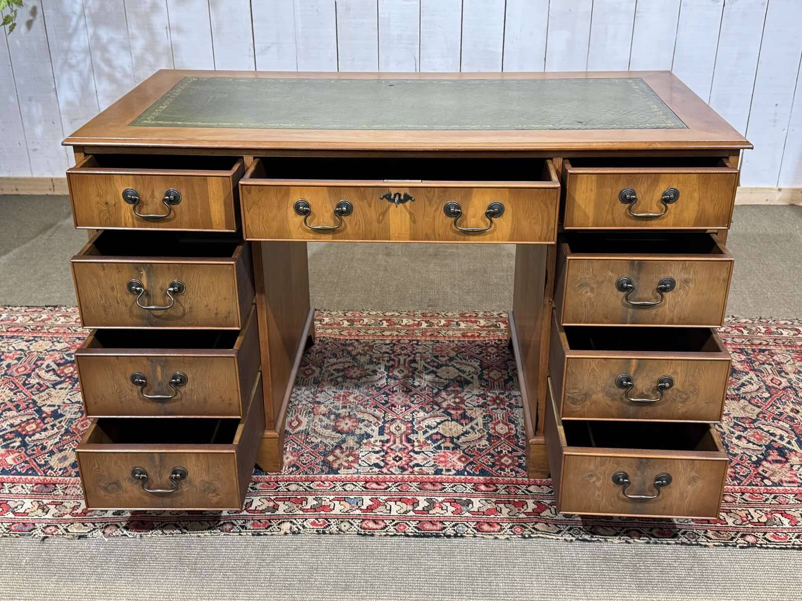 English flat desk with drawers from the 1970s in fir and leather top.