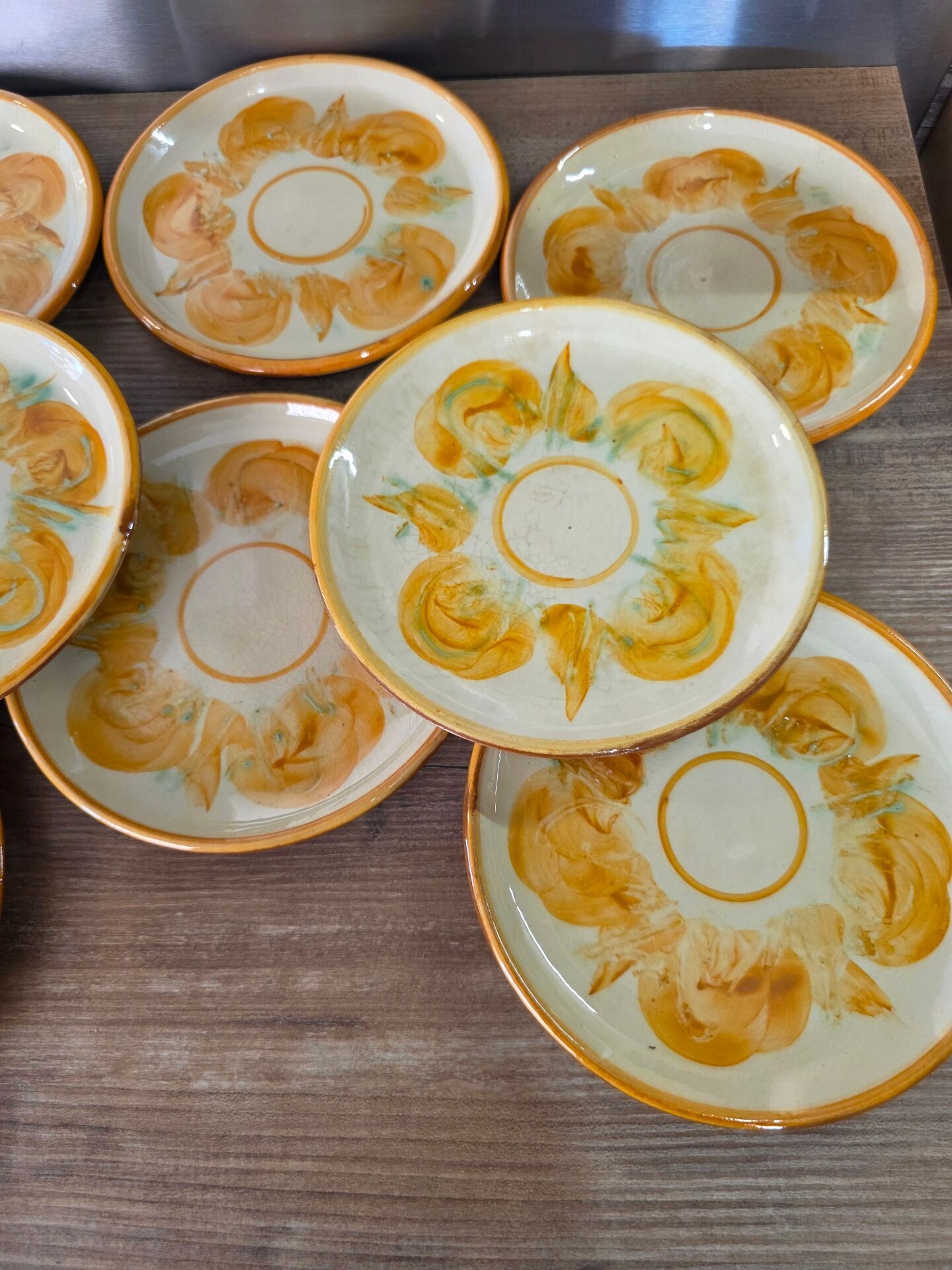 8 vintage dessert plates with a signed decoration.