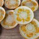 8 vintage dessert plates with a signed decoration.