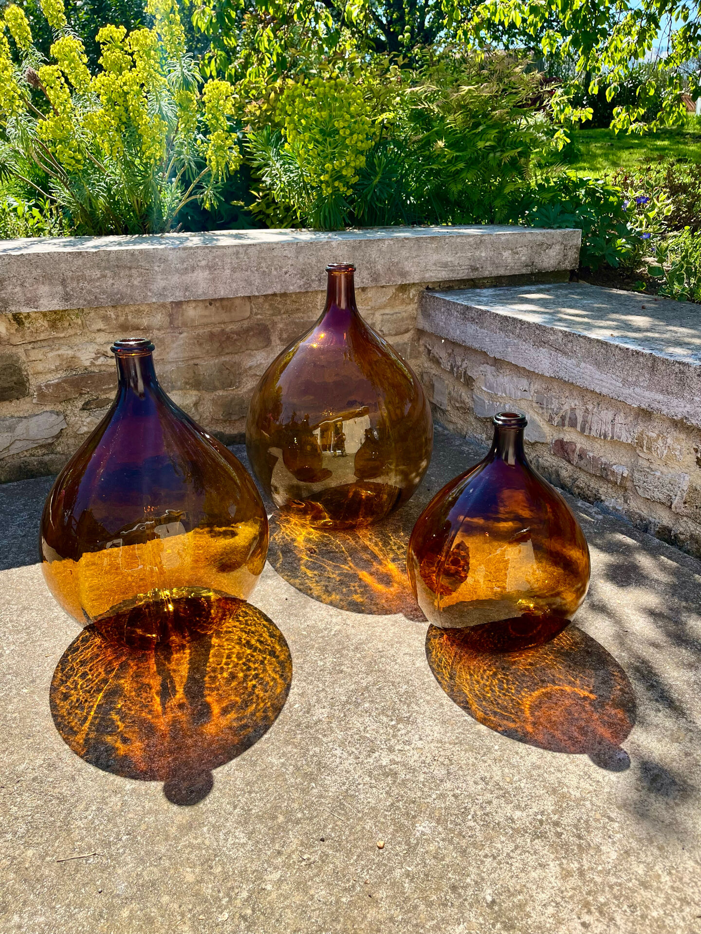 Lot de 3 dame-jeanne ambrées
