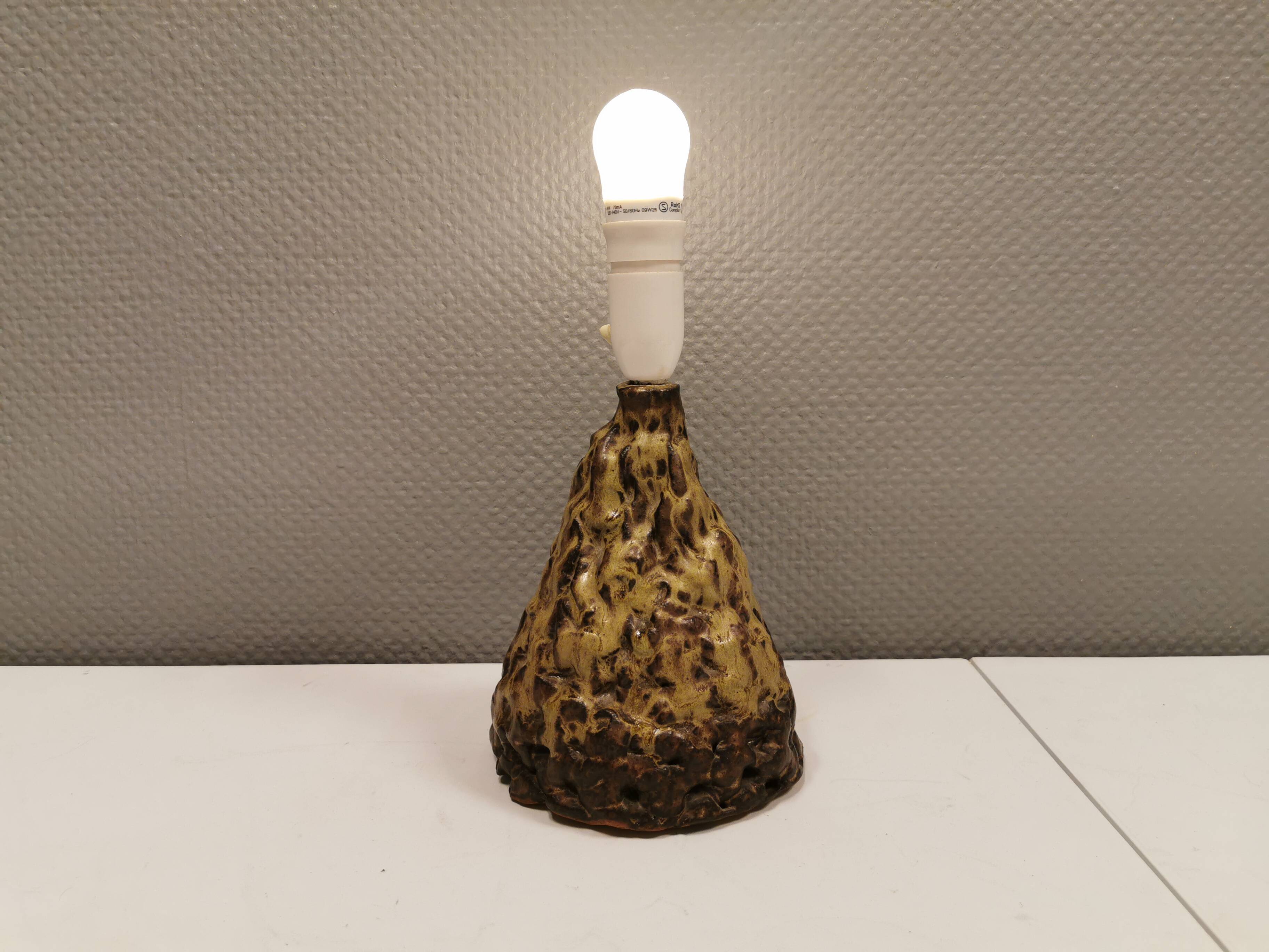Ceramic table lamp, in greenish/brownish glaze, almost in the shape of a volcano.