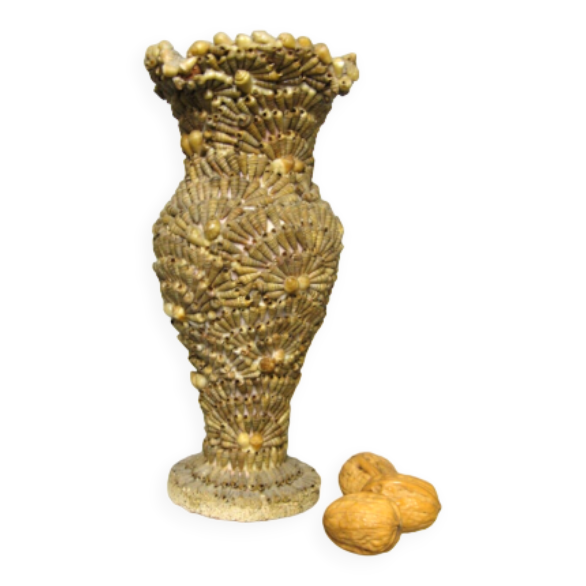 Vase covered with shells. Seaside souvenir.