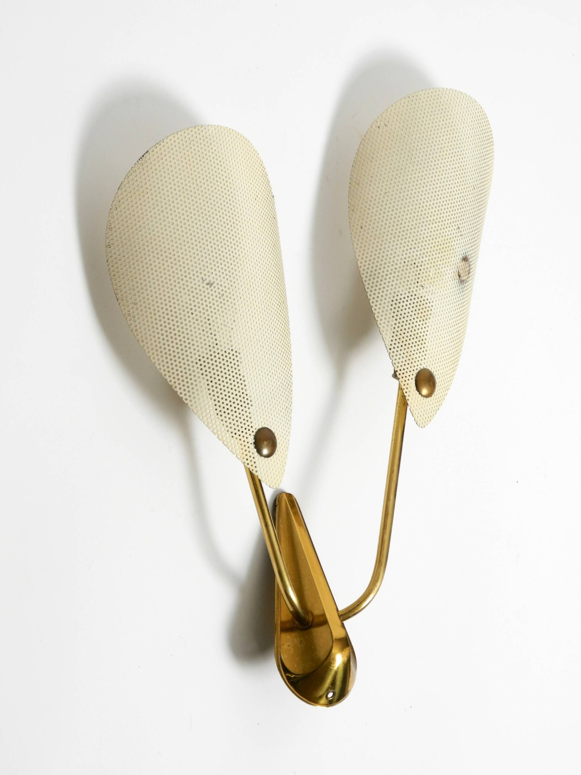 Mid Century Modern brass wall lamp with perforated metal sheet lampshades