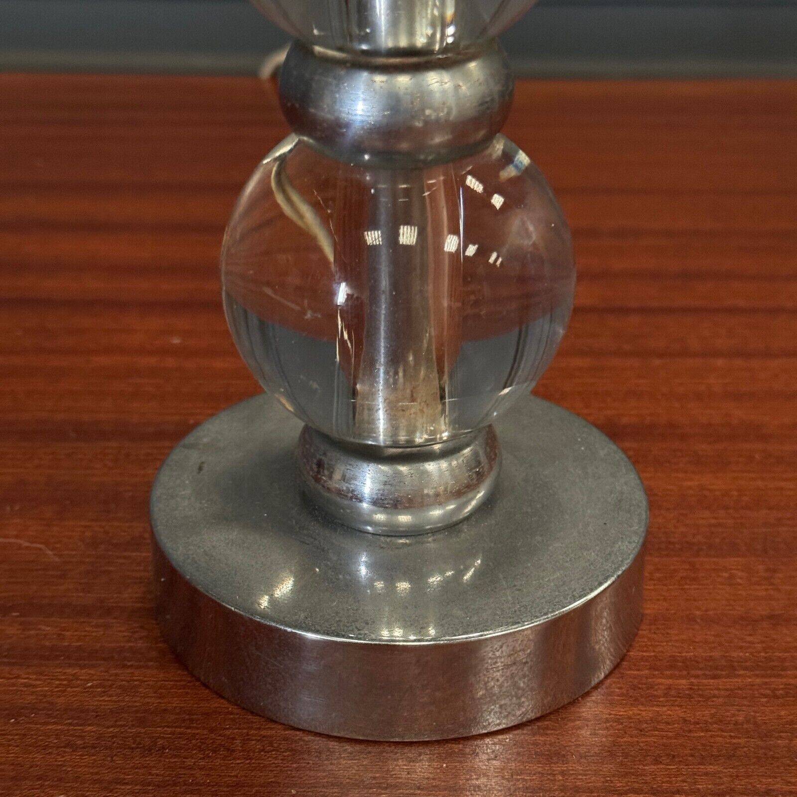 1950s lamp made up of two glass balls and a stainless steel base