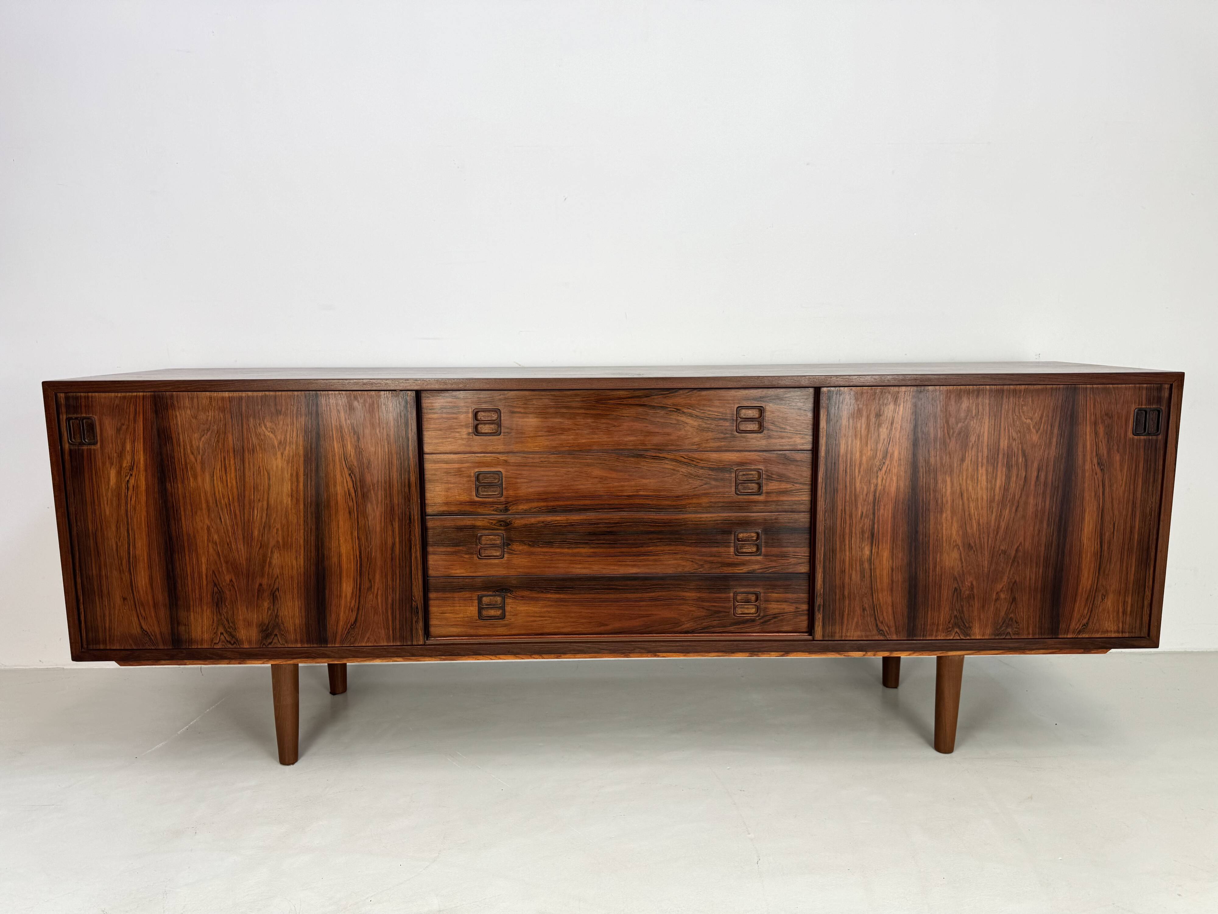 Danish rosewood vintage sideboard with sliding teak doors from the 1960s
