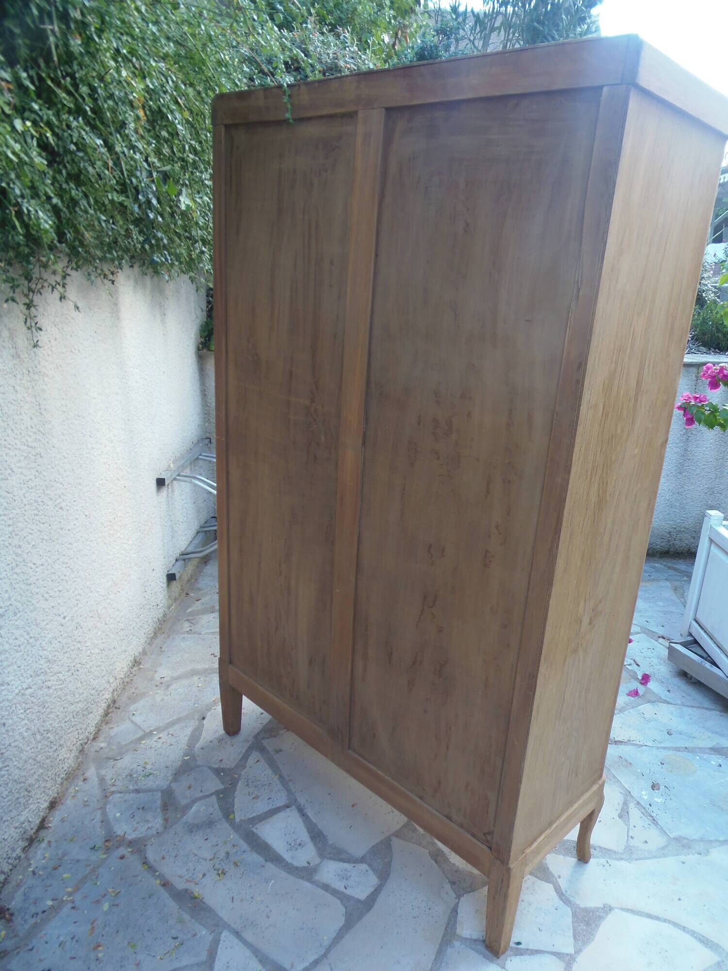 Charming vintage display cabinet from the 1950s in natural wood.