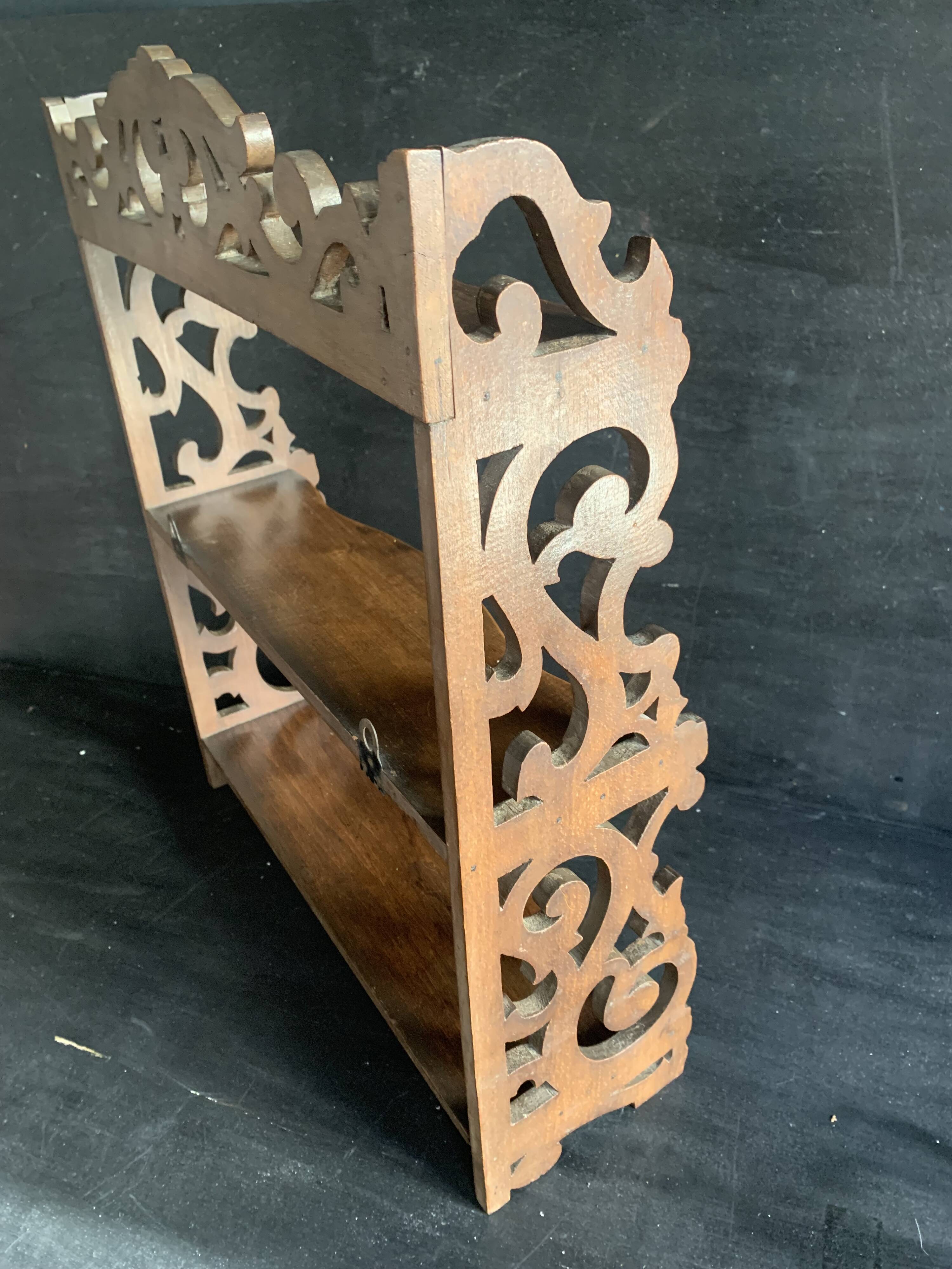 Antique shelf with openwork wooden pediment, early 20th century