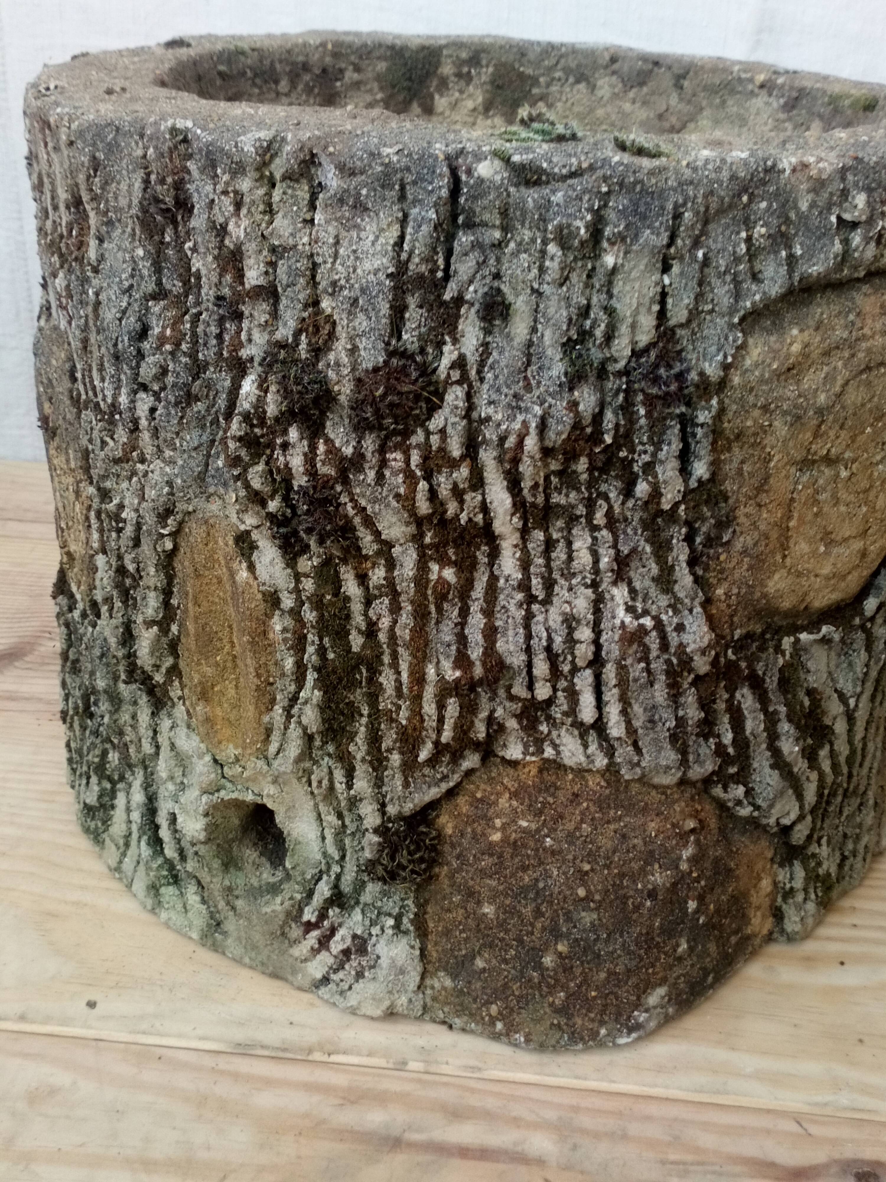 Pair of old rock garden planters in concrete