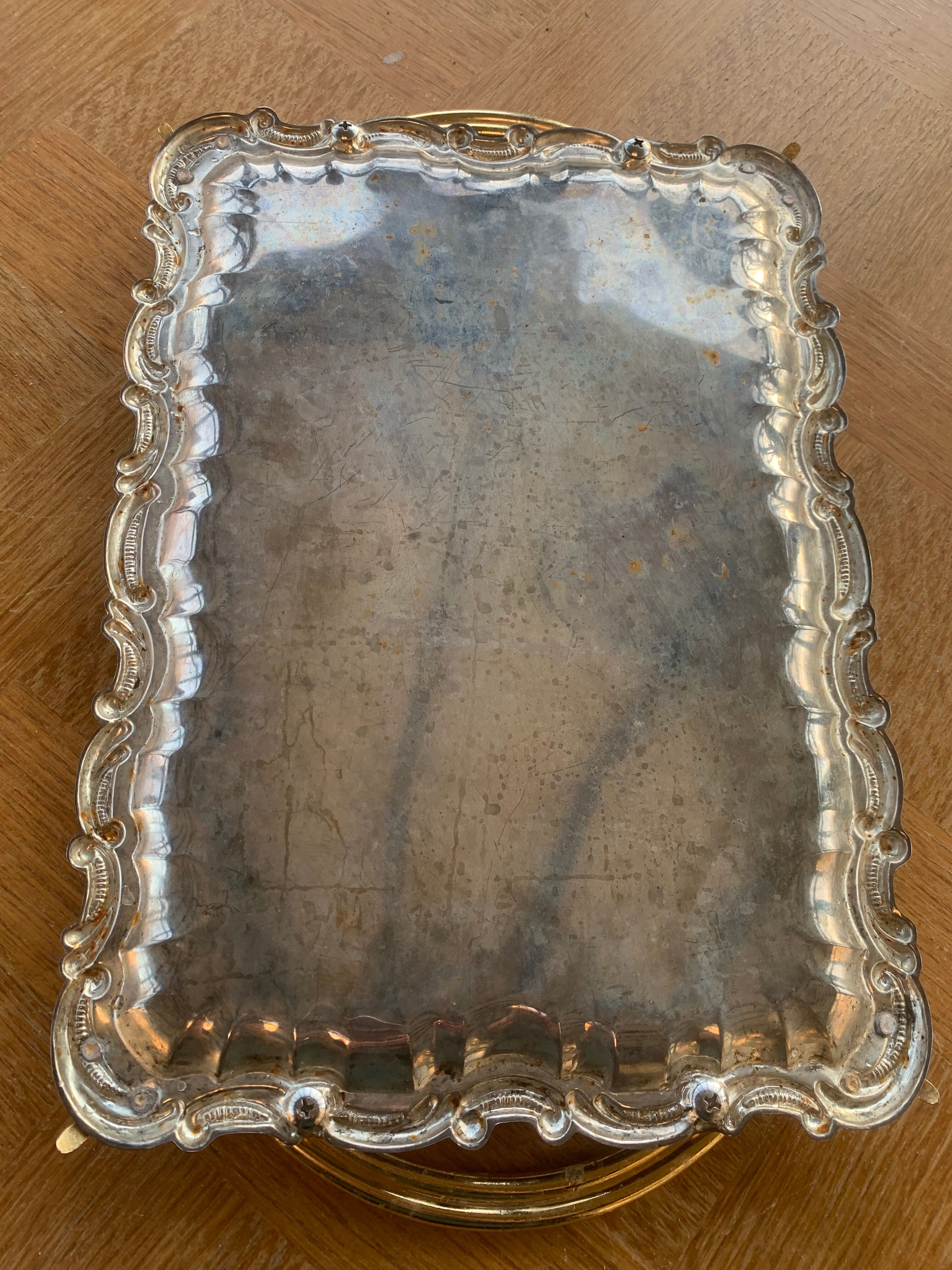 Silver metal top and decoration of foliage and handles in vintage brass