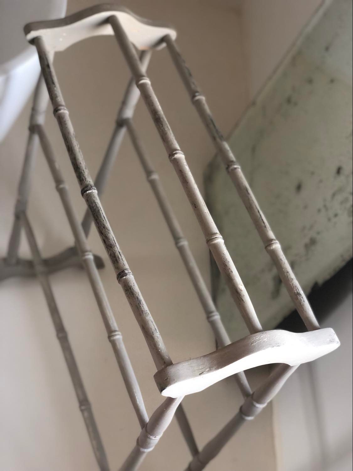 Old bathroom towel rack in patinated wood