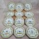 Set of 12 small antique plates by Alfred Renoleau, different designs.