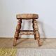 Tripod stool "Bobbin" style, turned wood and straw.